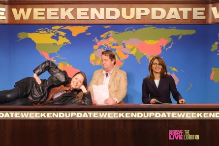 SNL's Weekend Update set with a superimposed Tina Fey